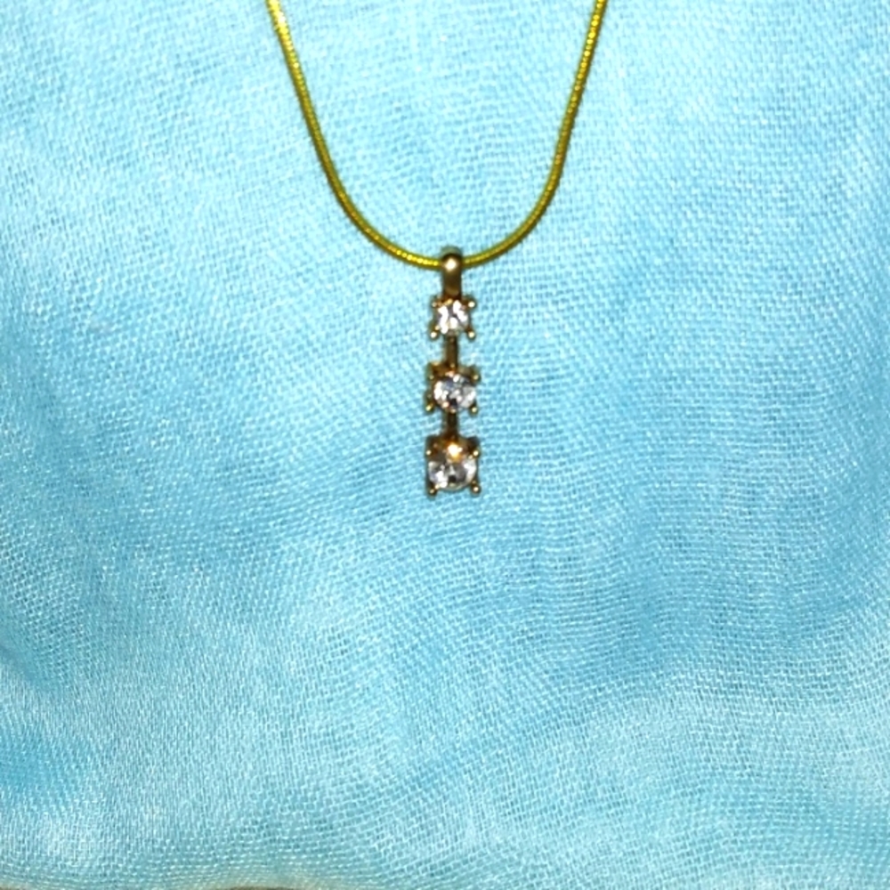 3-8-43 three stones on goldtone necklace good condition